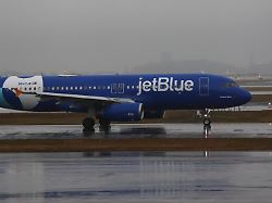 a jetblue plane on the tarmac at boston logan international airport tuesday dec 2 2025 in boston aaron m