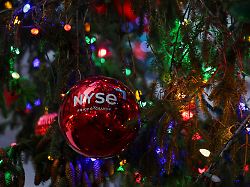a decoration hangs on a christmas tree outside the new york stock exchange nyse in new york city u s december 11 2025