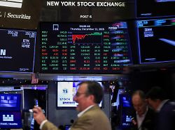 a screen displays the dow jones industrial average after close of trading on the floor at the new york stock exchange nyse in new york city u s december 11 2025