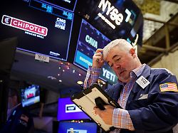 a trader works on the floor at the new york stock exchange nyse in new york city u s december 15 2025