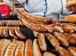 a vendour offers bratwurst at nuremberg christkindlesmarkt in nuremberg germany 29 november 2013 with a prologue the christ child opened the famous christmas market this afternoon