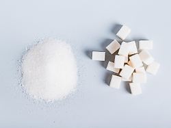 alternative between lump sugar and granulated sugar on a blue background top view