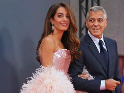 amal clooney left and george clooney pose for photographers upon arrival at the premiere of the film jay kelly during the london film festival in london friday oct 10 2025
