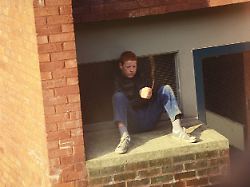 bored boy playing on a housing estate wycombe uk 1980 s