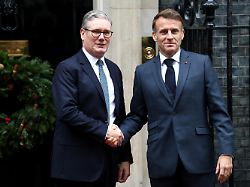 british prime minister keir starmer welcomes french president emmanuel macron at downing street in london england on december 8 2025 larry the downing street cat can be seen leaving