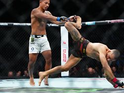 dec 6 2025 las vegas nevada united states alexandre pantoja red gloves fights joshua van blue gloves during ufc 323 at t mobile arena mandatory credit stephen r