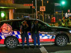 emergency personnel work at the scene of a shooting incident at bondi beach sydney australia december 14 2025
