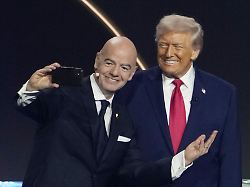 fifa president gianni infantino l takes a selfie with u s president donald trump during the 2026 world cup official draw in washington on dec 5 2025 1