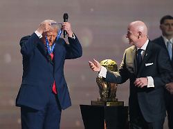 fifa president gianni infantino presents president donald trump with the fifa peace prize during the draw for the 2026 soccer world cup at the kennedy center in washington friday dec 5 2025