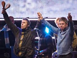 file liam gallagher left and noel gallagher of oasis walk onstage together during their reunion tour in toronto sunday aug 24 2025