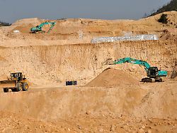 file workers use machinery to dig at a rare earth mine in ganxian county in central china s jiangxi province on dec 30 2010