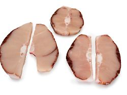 frozen blue shark slices isolated on white frozen fish slices