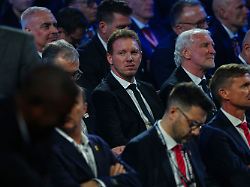 germany s coach julian nagelsmann center sits in the crowd during the draw for the 2026 soccer world cup at the kennedy center in washington friday dec 5 2025