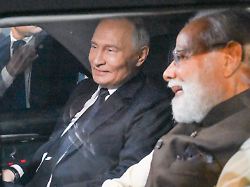 india december 4 2025 russia s president vladimir putin l and india s prime minister narendra modi are seen in a car at the palam air force base