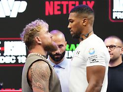 jake paul left and anthony joshua right face off during a news conference promoting their upcoming heavyweight boxing match friday nov 21 2025 in miami