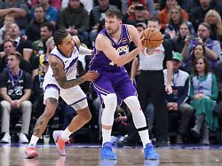 los angeles lakers guard luka doncic 77 posts up against utah jazz guard keyonte george left during the second half of an nba basketball game thursday dec 18 2025 in salt lake city