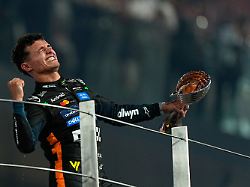 mclaren driver lando norris of britain celebrates after becoming a world champion after the formula one abu dhabi grand prix at the yas marina circuit in abu dhabi uae sunday dec 7 2025