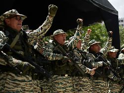 members of the bolivarian national militia cheer in unison during military exercises in caracas venezuela saturday sept 20 2025