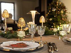 nice table with decoration and a christmas tree in the back during christmas celebrations in ronse renaix saturday 25 december 2021