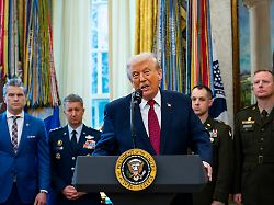 president donald trump speaks before presenting mexican border defense medals to 13 service members during a ceremony in the oval office of the white house in washington dc on monday december 15 2025