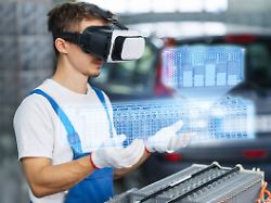 serviceman using virtual reality for electric car battery diagnostics model released symbolfoto property released ekgf00839
