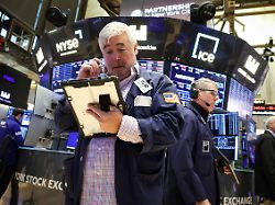 traders work on the floor at the new york stock exchange nyse in new york city u s december 1 2025