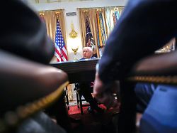 united states president donald j trump answers reporters questions as he holds a meeting with his cabinet in the cabinet room of the white house in washington dc usa on tuesday december 2 2025