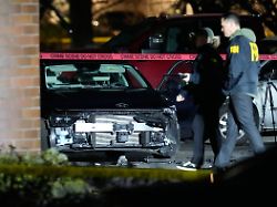 a damaged car is seen as law enforcement officials work the scene following reports that federal immigration officers shot and wounded people in portland ore thursday jan 8 2026