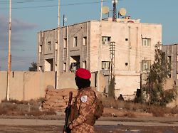 a member of syrian military police stands guard near raqqa prison where the syrian army is besieging sdf members after the army took control of the city of raqqa syria january 19 2026