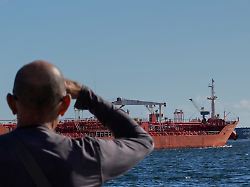 a person watches the oil tanker ocean mariner monrovia arrive to the bay in havana cuba friday jan 9 2026