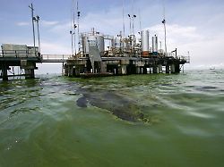 april 2 2019 maracaibo venezuela towers and oil platforms of the state oil pdvsa are observed on the shores of lake maracaibo on april 2 2022 in marcaibo venezuela