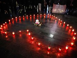 candles are set in a shape of a heart to commemorate the victims of the deadly fire in a bar in crans montana switzerland during a vigil in kocani north macedonia on saturday jan 10 2026