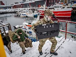 danish soldiers disembark at the harbor in nuuk greenland on sunday jan 18 2026