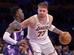 dec 28 2025 los angeles california usa sacramento kings guard dennis schroder 17 defemds los angeles lakers guard luka doncic 77 in the second half at crypto com arena