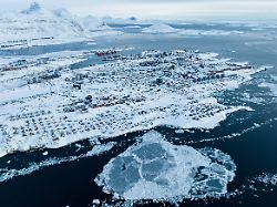 file houses covered by snow are seen on the coast of a sea inlet of nuuk greenland on march 7 2025