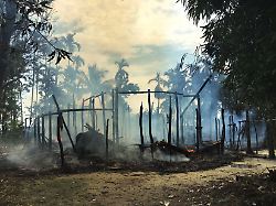 file in this sept 7 2017 file photo smoke rises from a burned house in gawdu zara village northern rakhine state where the vast majority of the country s 1 1 million rohingya lived myanmar