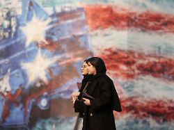 file photo people walk past an anti u s billboard in tehran iran january 26 2026