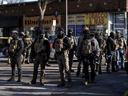federal agents stand guard at the scene of a shooting involving federal immigration agents in minneapolis minnesota u s january 24 2026