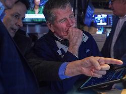 floor official patrick mckeon left and trader sean spain work on the floor of the new york stock exchange thursday jan 22 2026 1