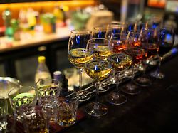glasses filled with various drinks are prepared by a bartender during an entertainment event at the zeppelin restaurant in novi sad serbia on december 20 2025