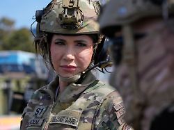 homeland security secretary kristi noem left speaks with a member of the maritime security response team after piloting a u s coast guard response boat small sunday march 16 2025 in san diego
