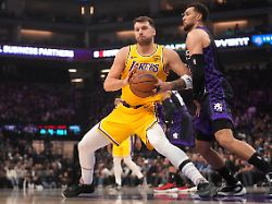 jan 12 2026 sacramento california usa los angeles lakers guard luka doncic 77 battles for position with sacramento kings guard zach lavine 8 in the first quarter at the golden 1 center