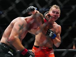 jan 24 2026 las vegas nevada usa justin gaethje red gloves fights paddy pimblett blue gloves during ufc 324 at t mobile arena mandatory credit stephen r