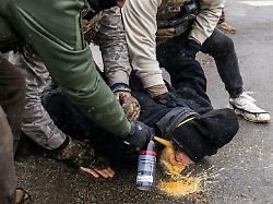 january 21 2026 federal agents pin a protester to the ground and spray a chemical irritant directly into his face at 28th and blaisdell avenue south in minneapolis on jan 21 2026