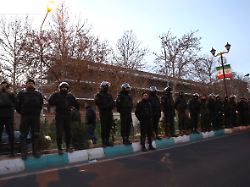 members of the iranian police stand guard at a protest in front of the british embassy following anti government protests in tehran iran january 14 2026