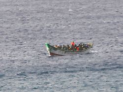 migrants are processed after their boat was intercepted traveling to tenerife spain from mauritania on january 26 2024