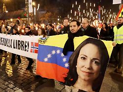 people take part in a parade celebrating venezuelan opposition leader maria corina machado receiving the nobel peace prize in oslo on dec 10 2025 as the award ceremony takes place the same day