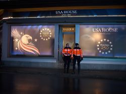 police officers guard in front of a branch office of the usa house at the eve of the start of the annual meeting of the world economy forum in davos switzerland sunday jan 18 2026