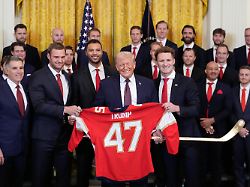 president donald trump poses for a photo during an event to honor the 2025 stanley cup champion florida panthers in the east room of the white house thursday jan 15 2026 in washington