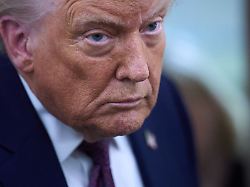 president donald trump speaks with reporters aboard air force one after leaving the world economic forum in davos for washington thursday jan 22 2026 1